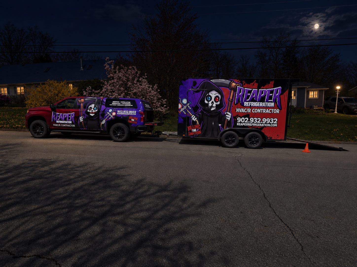 Reaper Refrigeration service trucks lit up at night